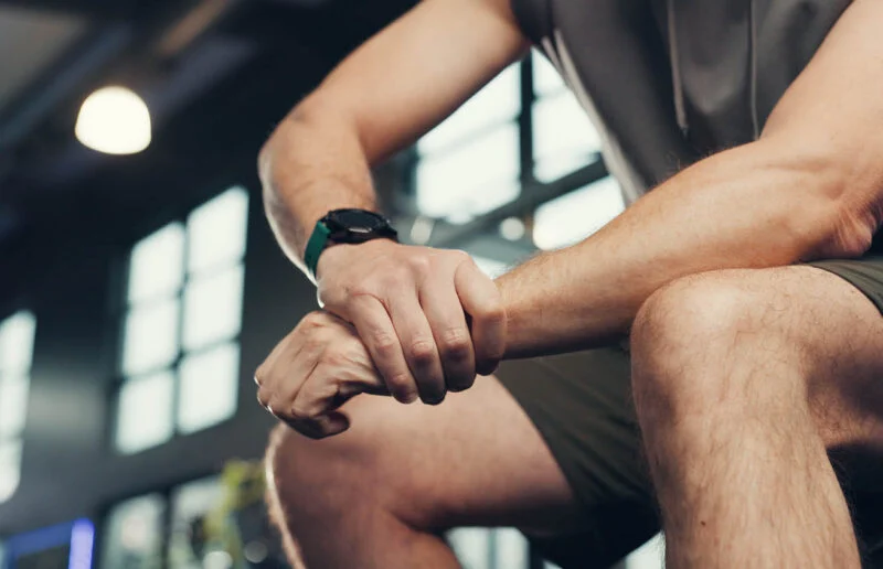 Hands, wrist pain and man in gym, training or fibromyalgia with carpal tunnel syndrome. Closeup, health center or person with workout, osteoporosis or joint injury with muscle tension or inflammation | Amarillo Medical Specialists Rheumatology