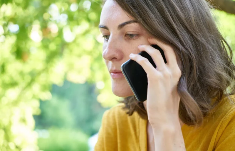 Woman on the phone sorting out medication coverage