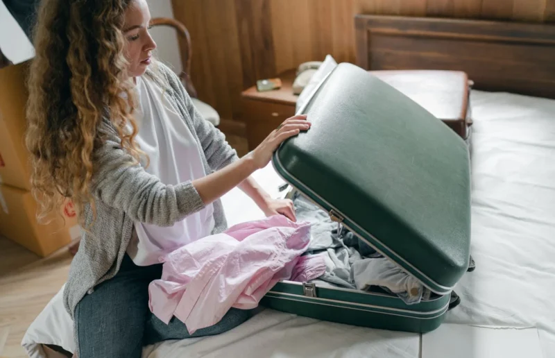 Woman packing a suitcase for a trip
